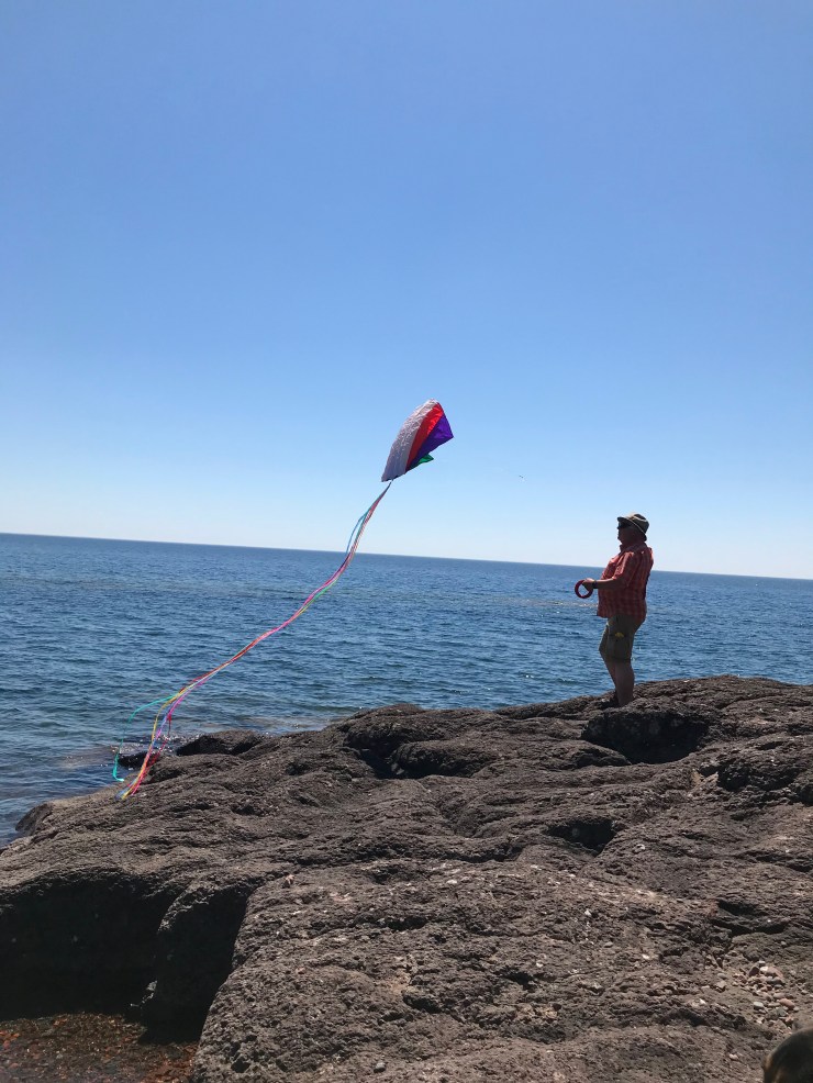 Flying a kite over the Lake Superior shore